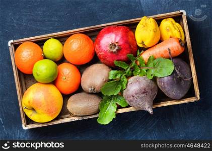 Colorful fruits and vegetables. Box with apple, tangerine, lime and pomegranate.Dieting,detox and vegetarian
