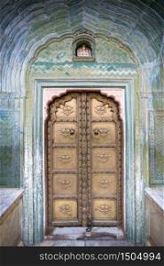 Colorful gate door in pink city at City Palace of Jaipur, Rajasthan, India