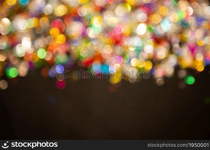 colorful, gold light Festive Christmas background. Abstract twinkled bright background with bokeh defocused golden lights