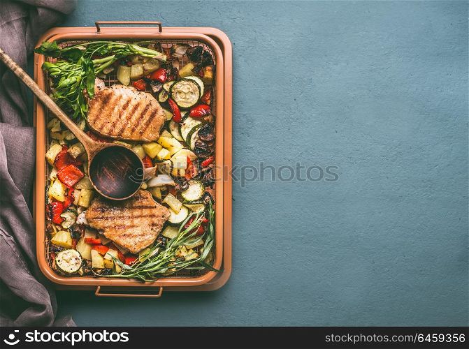 Colorful grilled vegetables and meat in grill grate try with cooking spoon on kitchen table background, top view with copy space