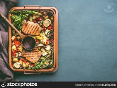 Colorful grilled vegetables and meat in grill grate try with cooking spoon on kitchen table background, top view with copy space