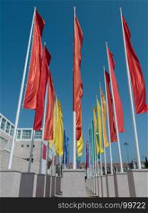 Colorful Groups of Flags against Blue Sky