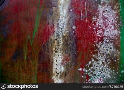 Colorful grunge background of rusty iron surface with paint stains