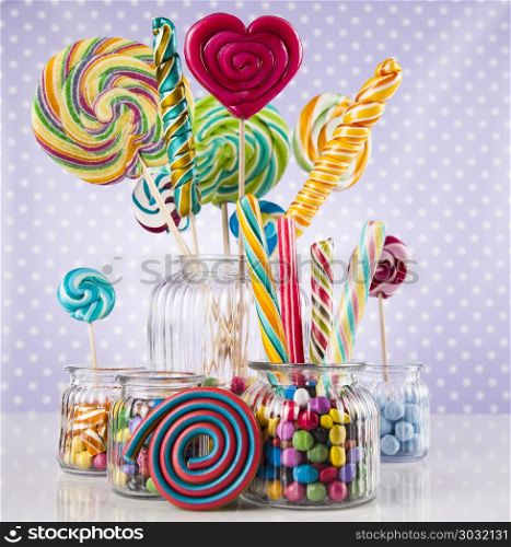 Colorful gum sweet candy and lollipops and gum balls. Colorful candies and lollipops, gumballs