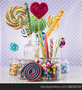Colorful gum sweet candy and lollipops and gum balls. Colorful candies and lollipops, gumballs