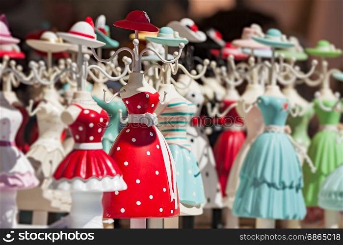 Colorful hanging doll souvenirs in a market. Hanging souvenirs in a market