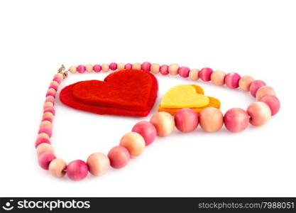 Colorful hearts and wooden necklace on white background.