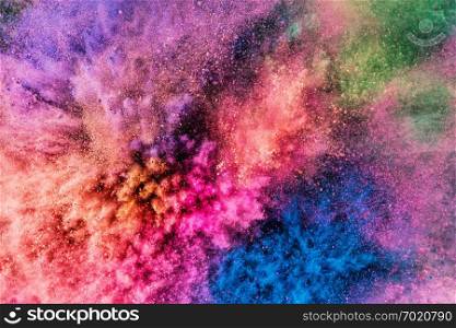 Colorful holi powder blowing up. Holi festival and celebration. Background.. Colorful holi powder blowing up.