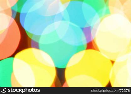 Colorful holiday background with defocused lights