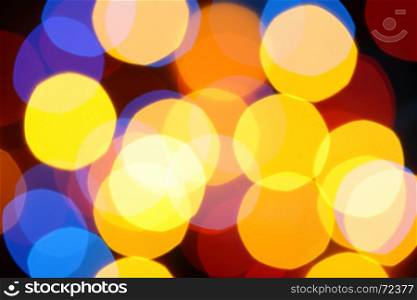 Colorful holiday background with defocused lights
