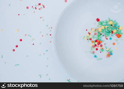 Colorful Holiday Background. Yellow red green orange blue circles, doodles, flowers against white backdrop. Easter, birthday greeting card or web banner concept with Copy Space. Top view. Flat lay