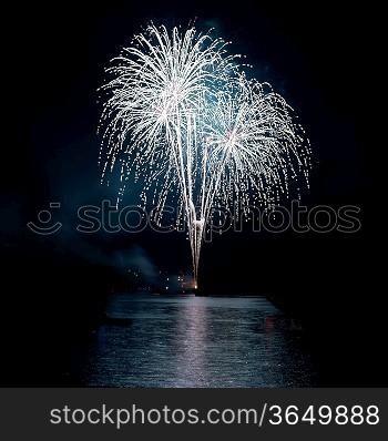 Colorful holiday fireworks on the black sky background.