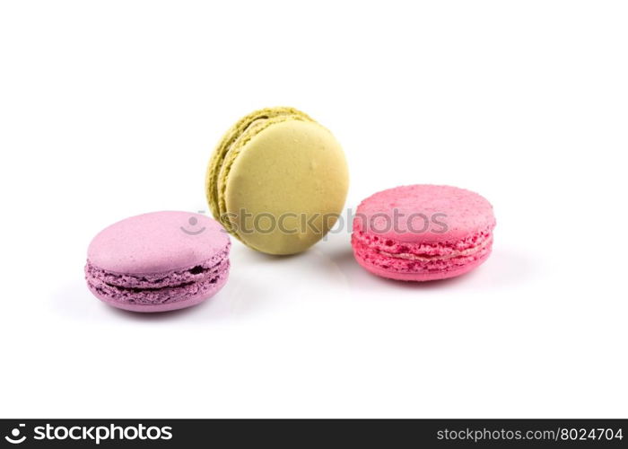 Colorful homemade macaroons on a white background