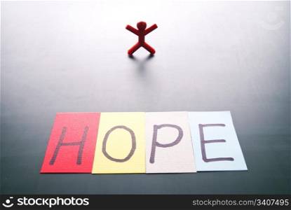 Colorful hope word and single person with back light shadow