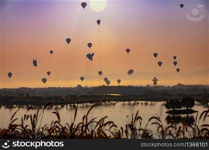 Colorful hot air balloons flying over river