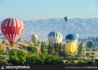 Colorful hot-air balloons flying over the cappadocia