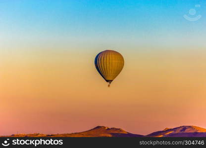 Colorful hot air balloons flying over the valley at Cappadocia,Anatolia,Turkey.NEVSEHIR/TURKEY- JULY 23,2016. Colorful hot air balloons flying over the valley at Cappadocia,Anatolia,Turkey.The great tourist attraction of Cappadocia best places to fly with hot air balloons.NEVSEHIR/TURKEY- JULY 23,2016