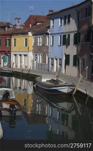 Colorful houses in a typical street in Burano Venice