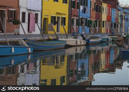 Colorful houses in a typical street in Burano Venice