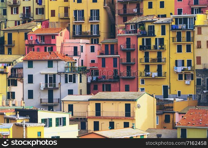 Colorful houses in Manarola Village, Cinque Terre Coast of Italy. Manarola is a beautiful small town in the province of La Spezia, Liguria, north of Italy and one of the five Cinque terre attractions.