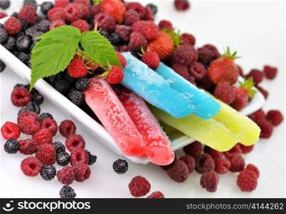 colorful ice cream pops with fresh raspberries and blackberries