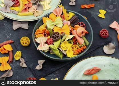 Colorful Italian pasta. Various colors of pasta. Colored pasta on the plate