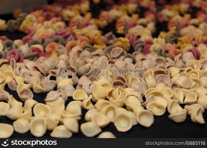 Colorful Italian Uncooked Pasta Assortment on Table, Orecchiette Pugliesi