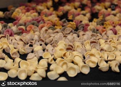 Colorful Italian Uncooked Pasta Assortment on Table, Orecchiette Pugliesi