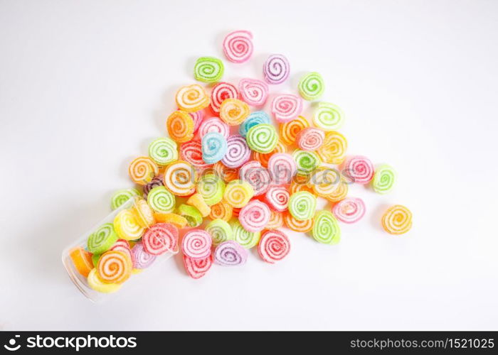 colorful jelly sugar candies on white background, top view