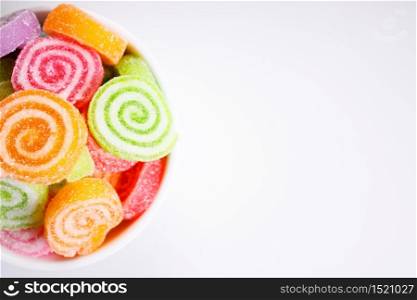 colorful jelly sugar candies on white background, top view