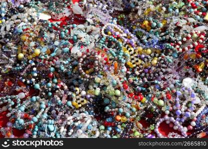 colorful jewelry necklaces mess in market pattern background