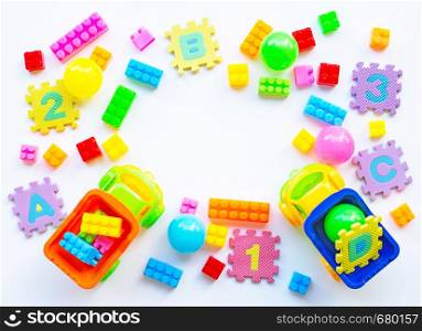Colorful Kids toys on white background. Copy space