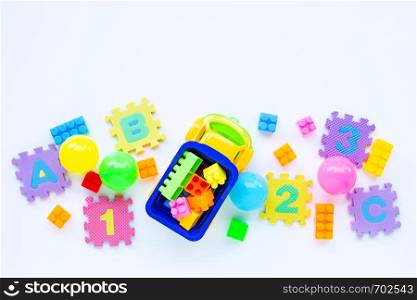 Colorful Kids toys on white background. Copy space