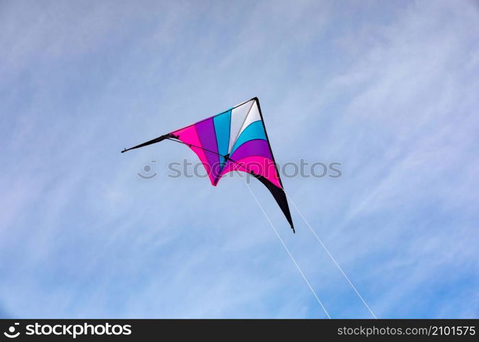 Colorful kite flying in the blue sky