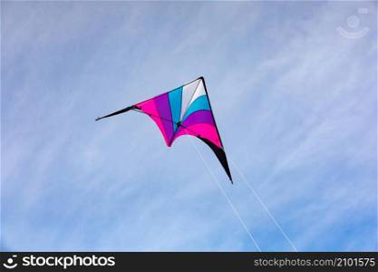 Colorful kite flying in the blue sky