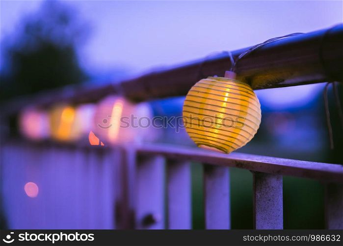 Colorful lampions outside, twilight hour, garden party
