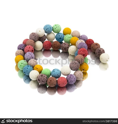 Colorful lava volcano beads with reflection. White background.