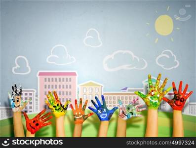 Colorful life!. Human hands in colorful paint showing symbols
