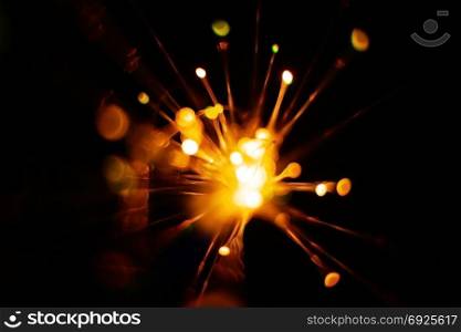 Colorful light explosion on black background. Futuristic wallpaper. Light explosion background