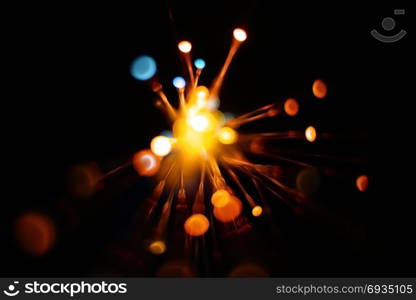 Colorful light explosion on black background. Futuristic wallpaper. Light explosion background