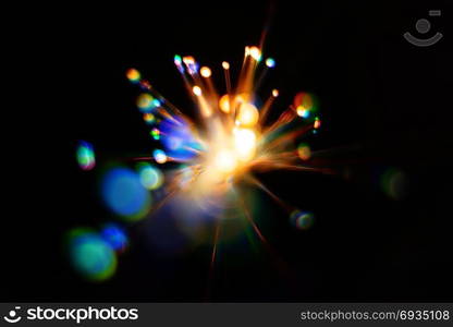 Colorful light explosion on black background. Futuristic wallpaper. Light explosion background