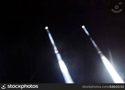 Colorful lights and smoke on a stage.