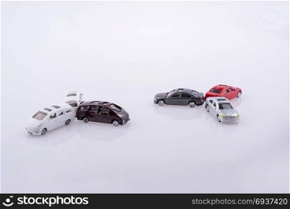 Colorful little toy cars on white background