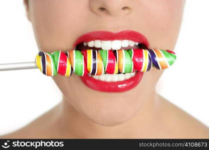 Colorful Lollypop in perfect woman teeth and red lips mouth