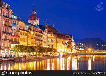 Colorful Luzern Reuss river waterfront evening view, historic Switzerland landmarks 