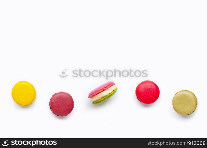 Colorful macarons isolated on white background.