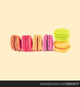 colorful macarons on vintage background