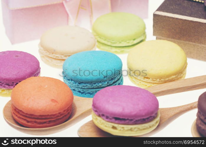 Colorful macarons on white background. Macaron is sweet meringue-based confection.