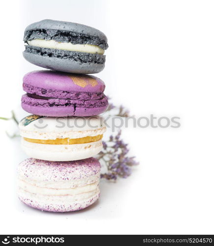 colorful macaroon cakes against white background