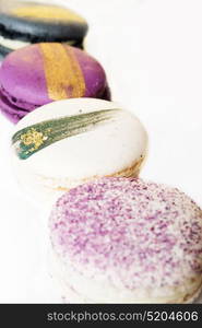 colorful macaroon cakes against white background